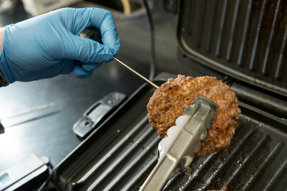 Grilling hamburger patty