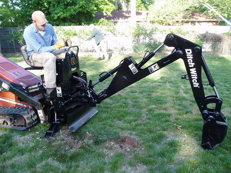 Students testing a ditch witch attachment