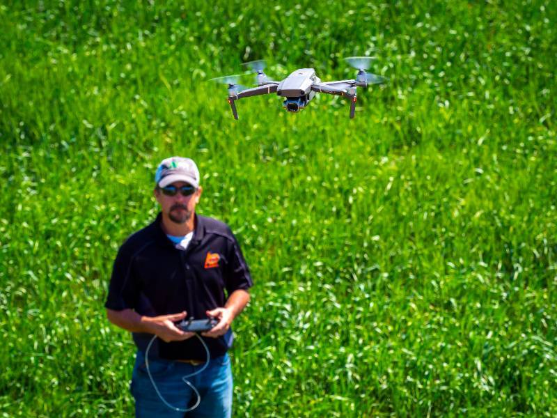 A ground operator running a drone.