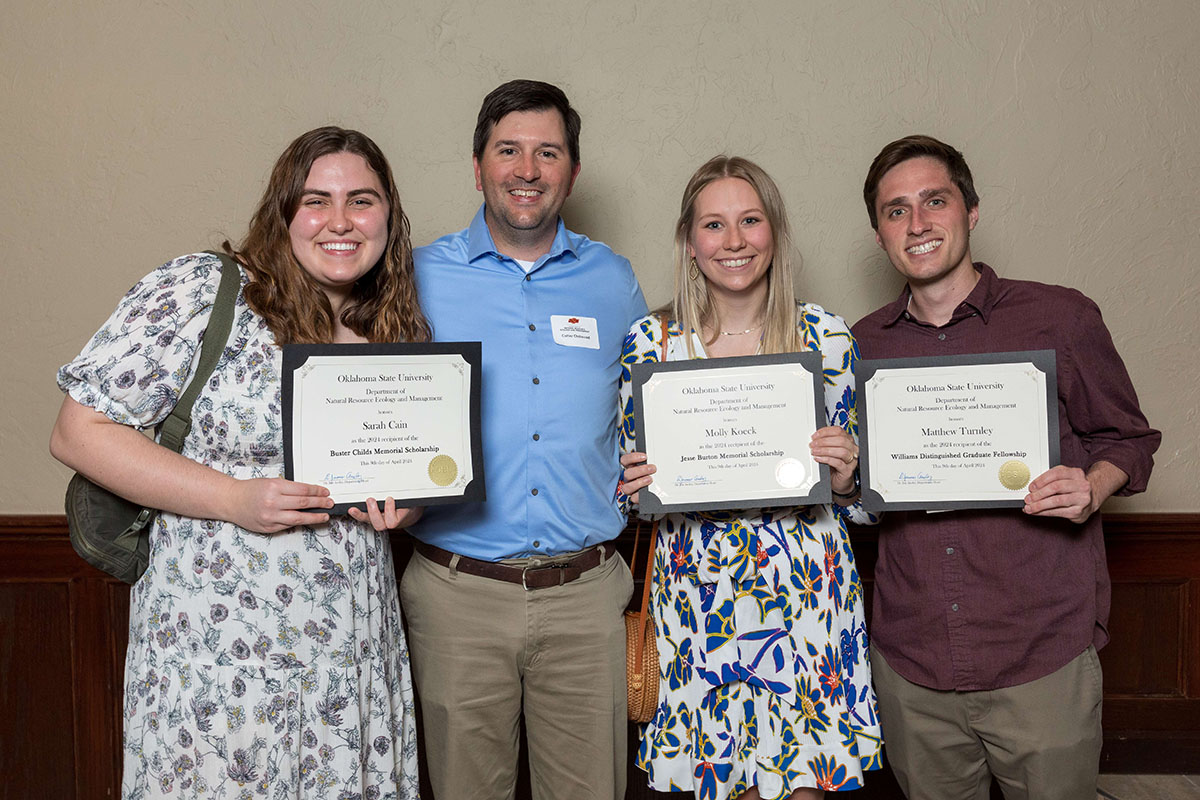 A group photo with Sara, Molly and Matthew showing of their awards.