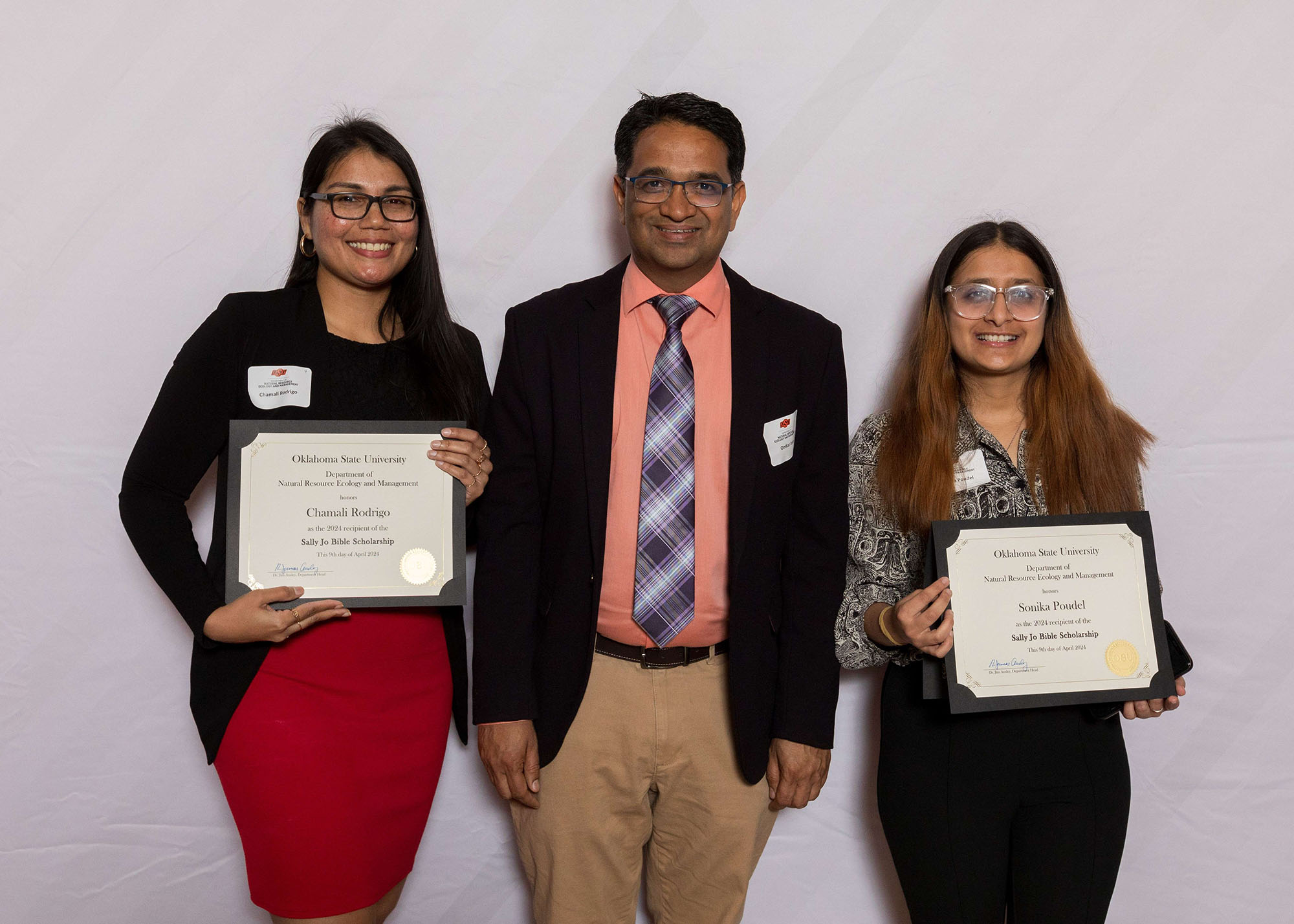 Chamali Rodrigo and Sonia Poodle showing of their awards with Dr. Omkar Joshi.