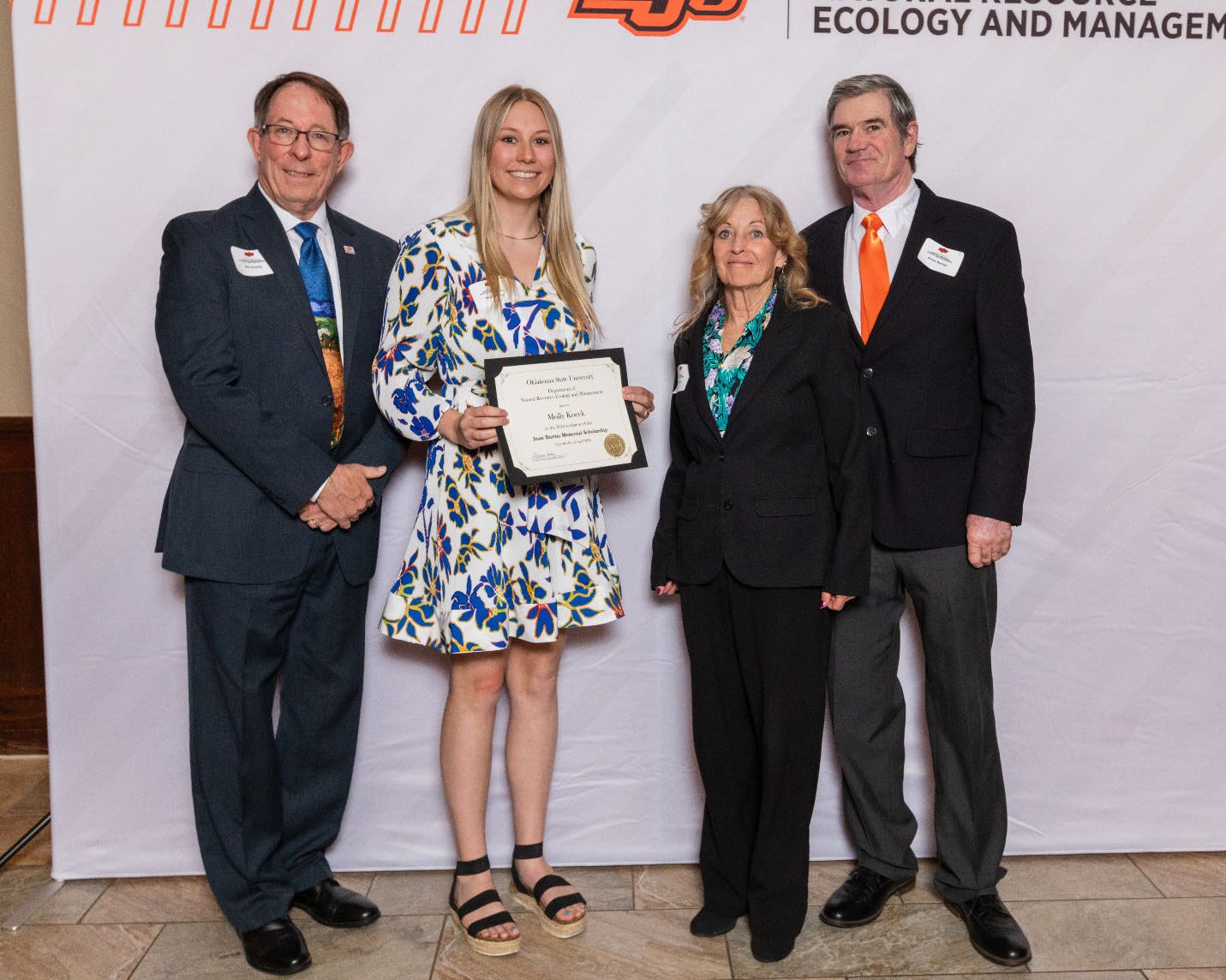 Molly with Jesse’s parents and Dr. Jim Ansley.