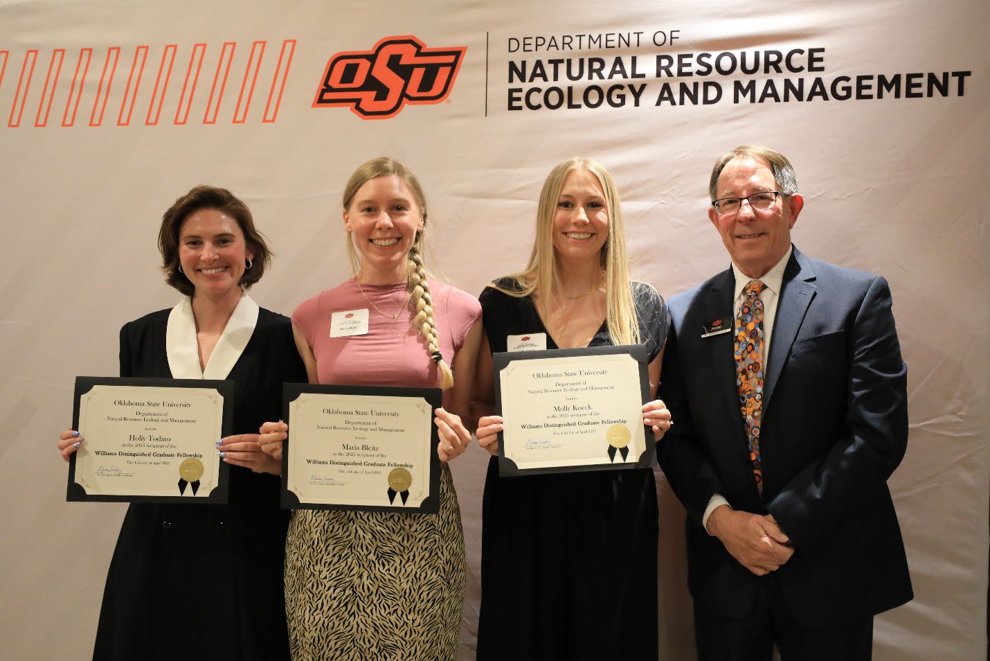 Holly Todaro, Maria Bleitz and Molly Koeck holding their plaque next to Dr. Jim Ansley.
