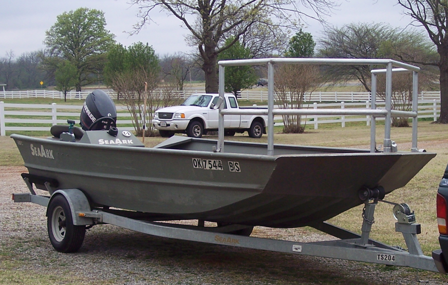 A boat sitting on a trailer. 