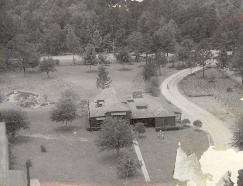 An aerial view of a cabin and the land around the cabin.