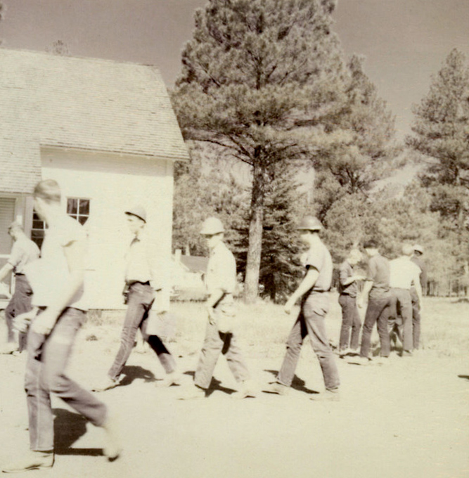 A group of people walking outside.