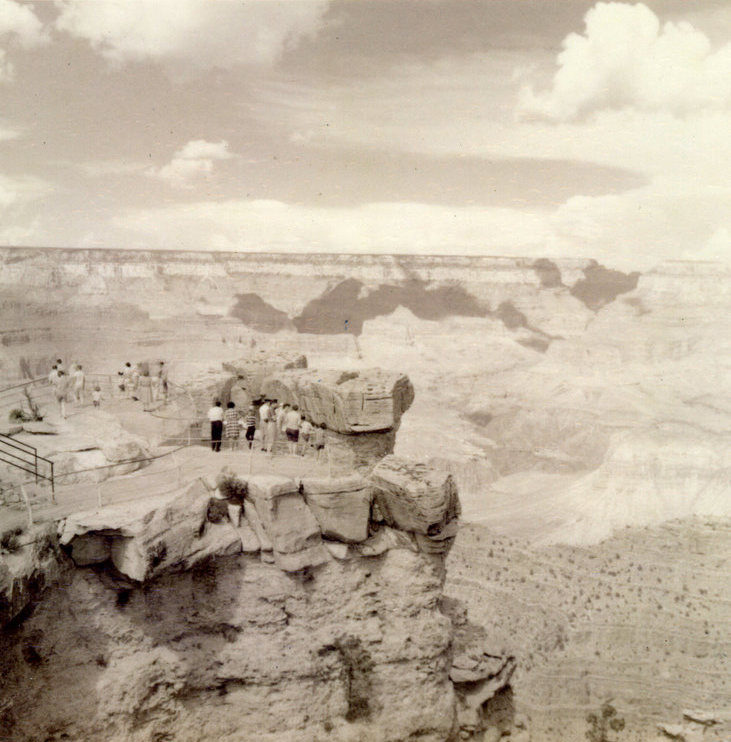 A group of students standing on rocks.