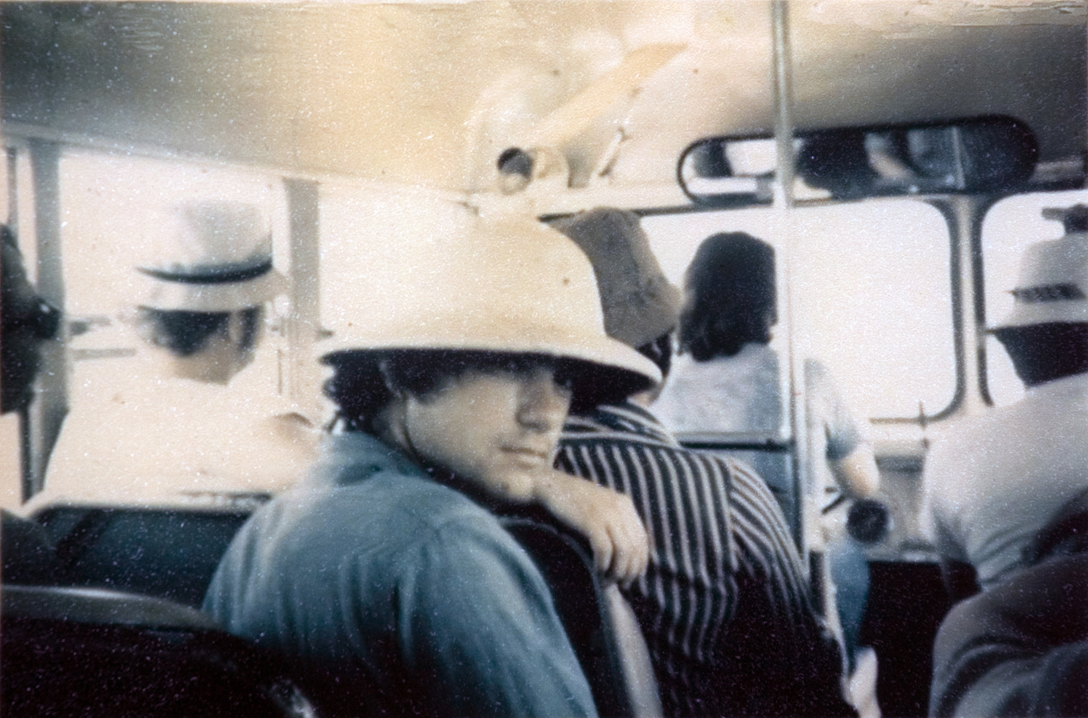 Students sitting on a bus.