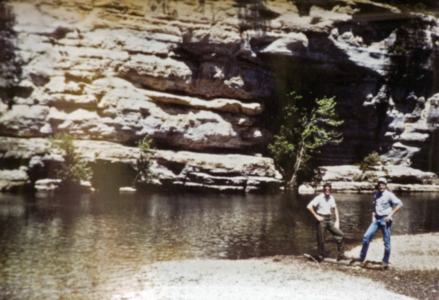 Two students pose at the bottom of a canyon near the stream.