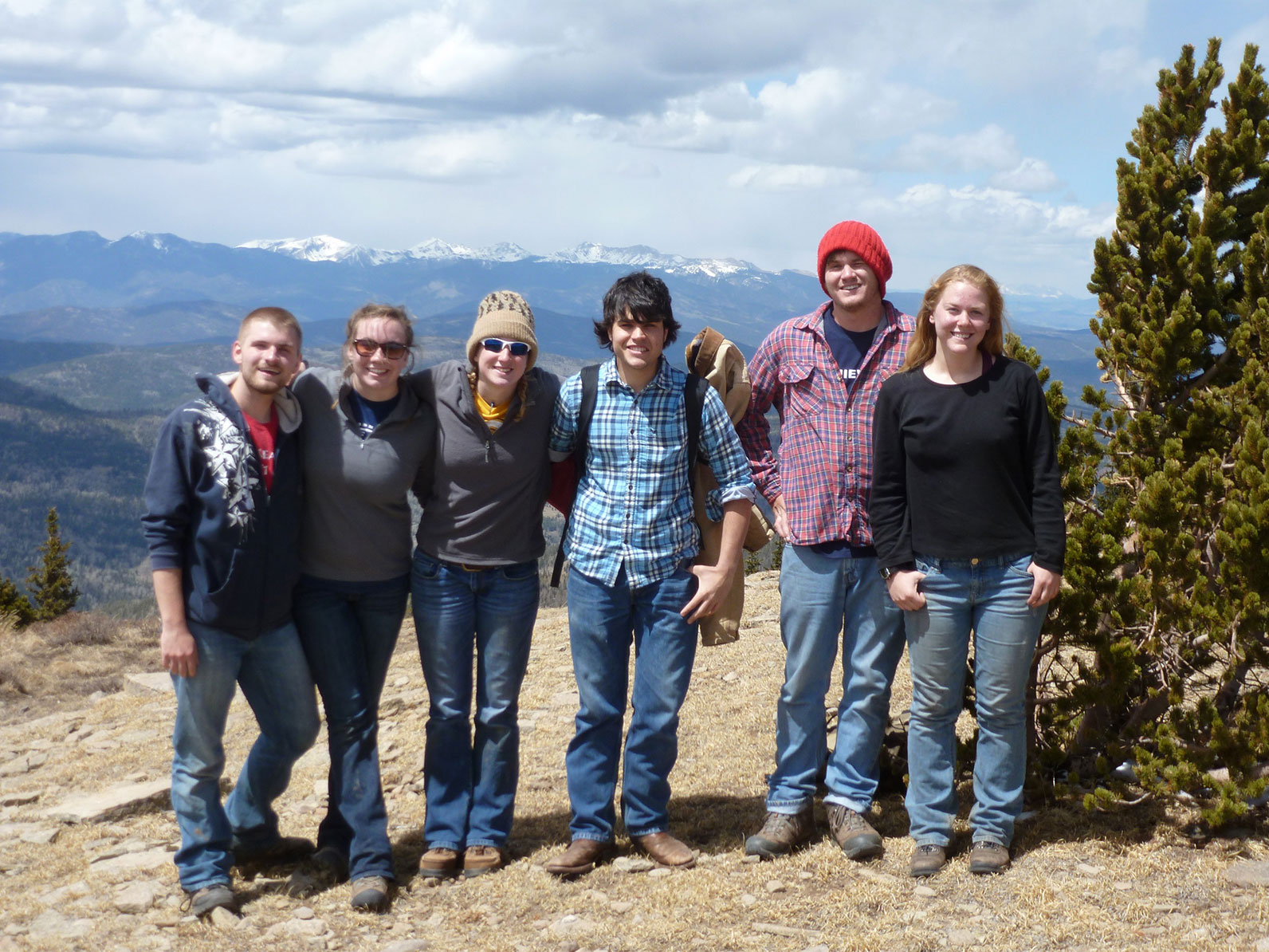 A group photo of participants standing at an overlook.
