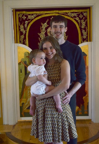 Jacob Seagraves is accepting his award from Jim Ansley in front of a book shelf