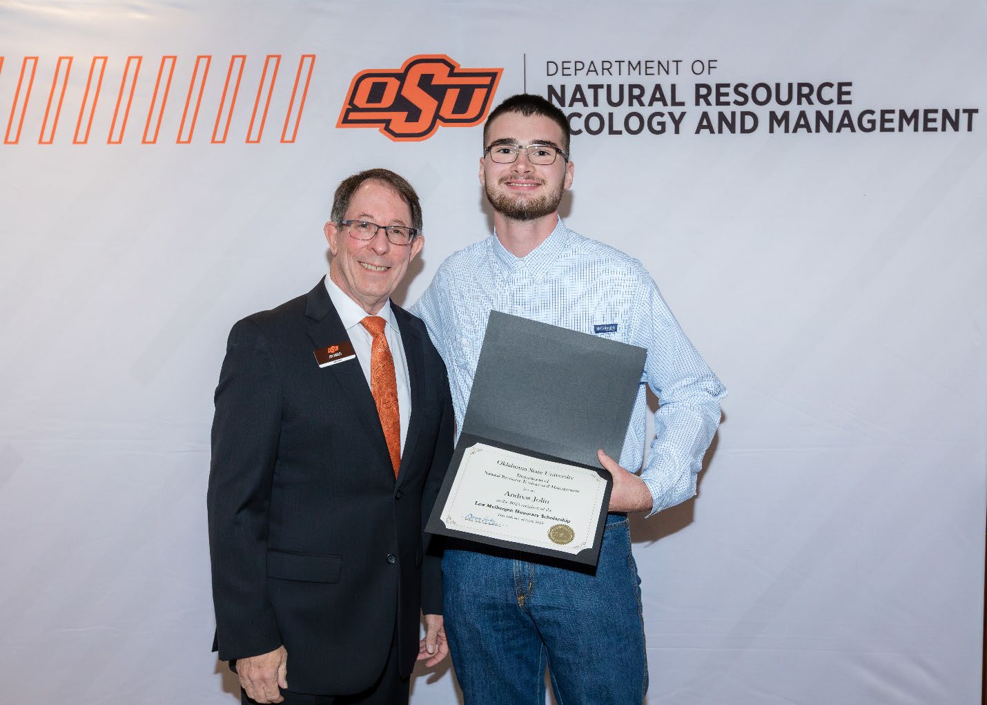 Andrew Jolin with Jim Ansley accepting his Undergraduate Student Scholarship award.