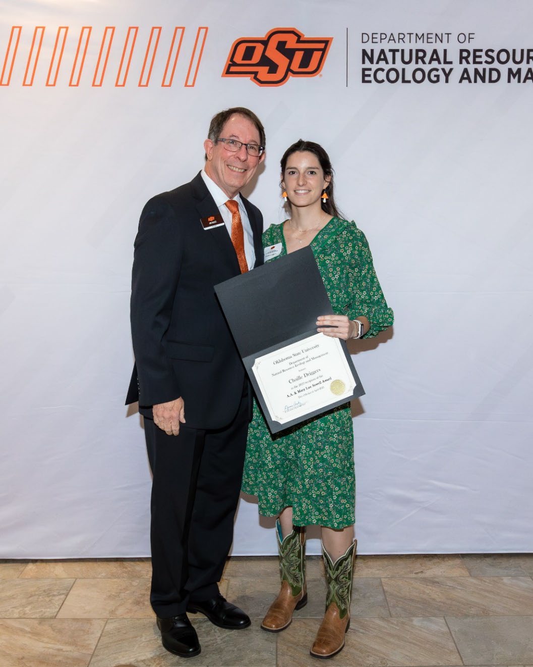 Chaille Driggers with Jim Ansley accepting her Undergraduate Student Scholarship award.