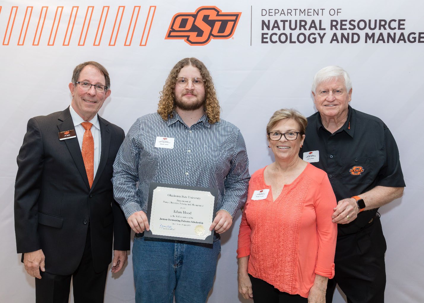 Ethan and Donors with Jim Ansley accepting their Undergraduate Student Scholarship award.