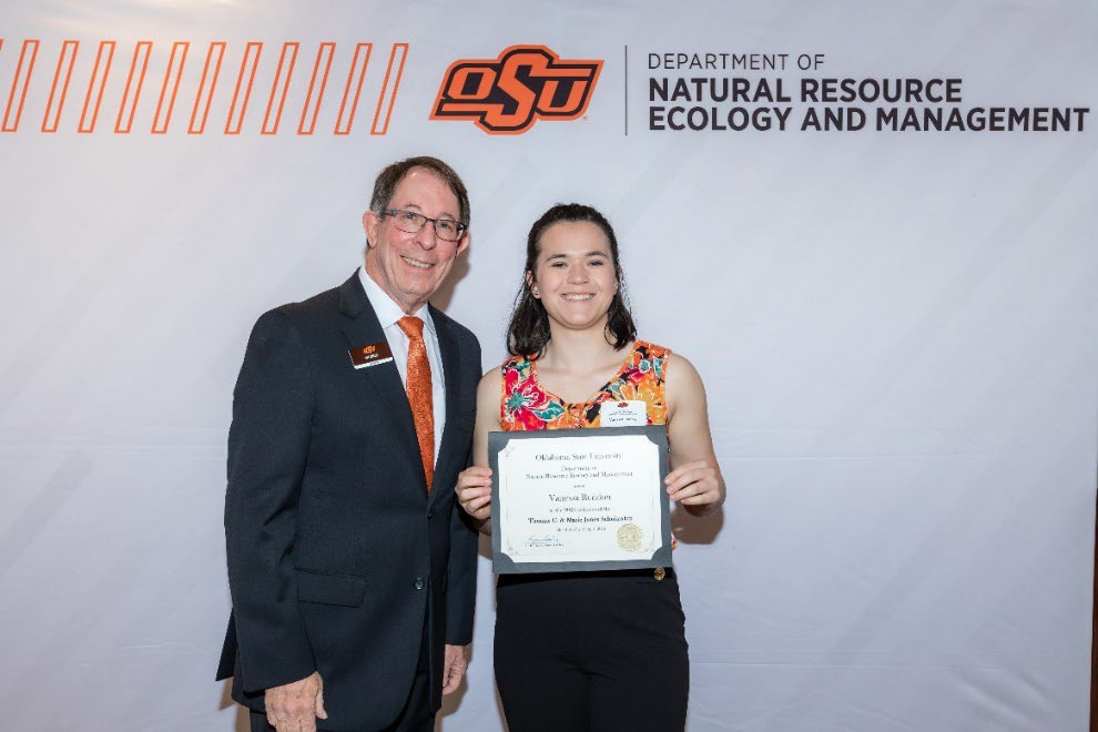 Vanessa Rendon with Jim Ansley accepting her Undergraduate Student Scholarship award.