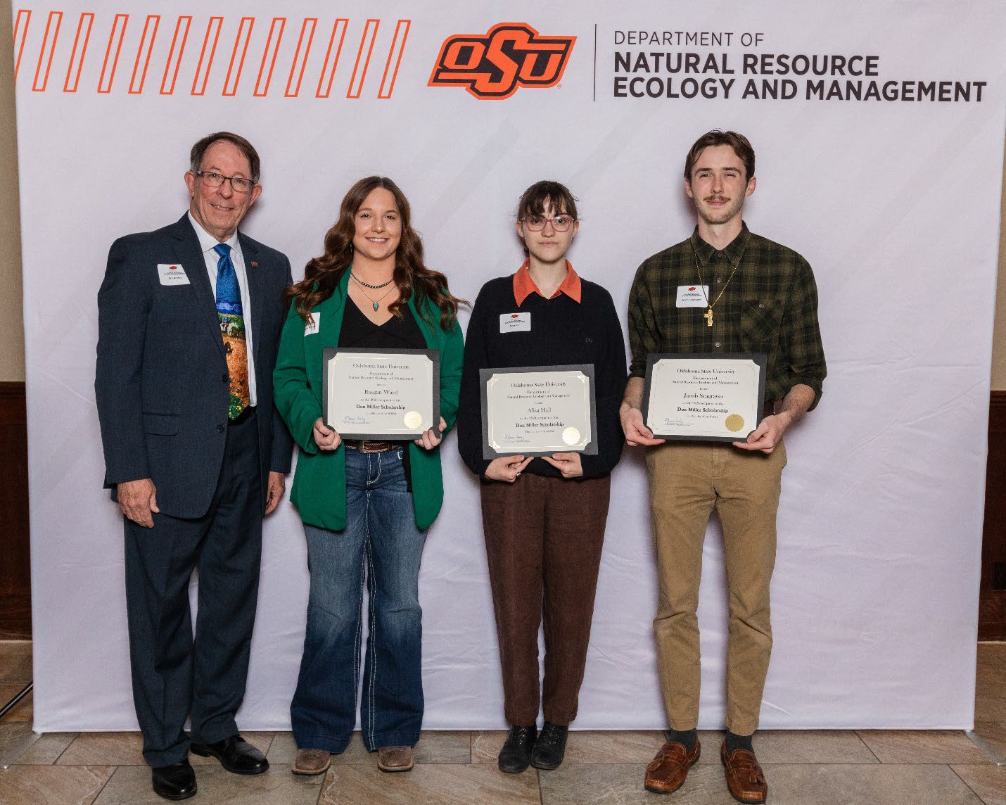 Alisa, Ethan, Raegan and Jacob with showing their award with Dr. Jim Ansley.