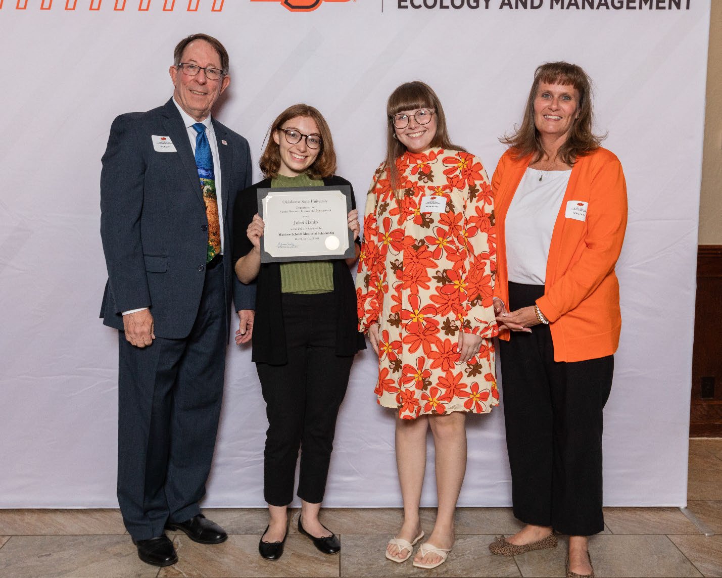 Juliet with Donors and Julie holding her award next to Dr. Jim Ansley.