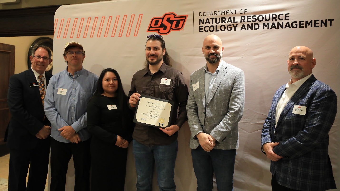Cameron Miller with his award and Ryan Crager, Ty Crager, Jake Miller, Russell Vaughn and Dr. Jim Ansley.
