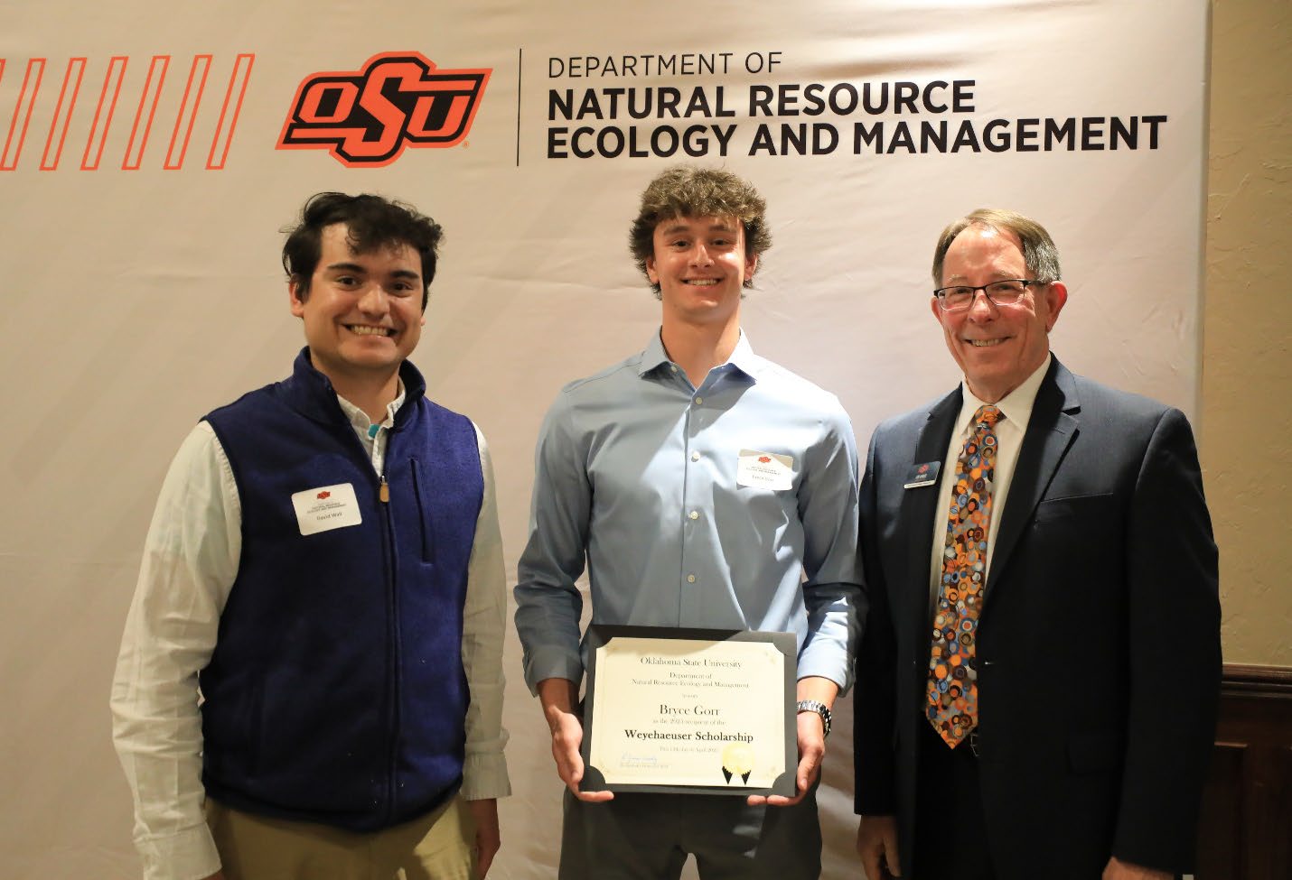 Bryce Gorr with his award between David Wall and Dr. Jim Ansley.