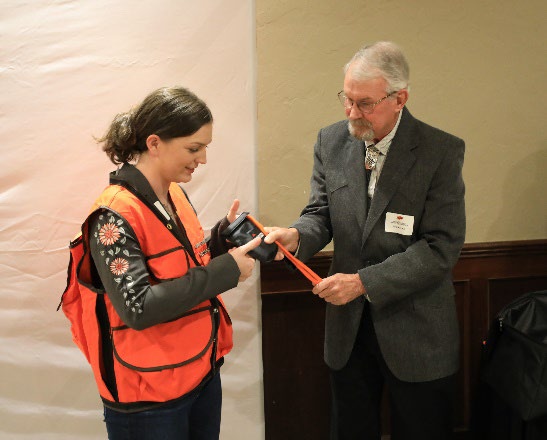 Dr. Tom Kuzmic giving Samantha the forestry award.