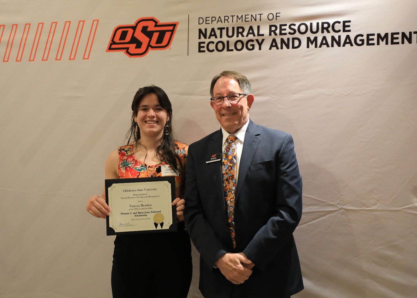 Vanessa Rendon with her plaque next to Dr. Jim Ansley.