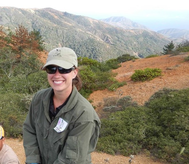 Woman starring at the camera with beautiful scenery behind her. Woman starring at the camera with beautiful scenery behind her.