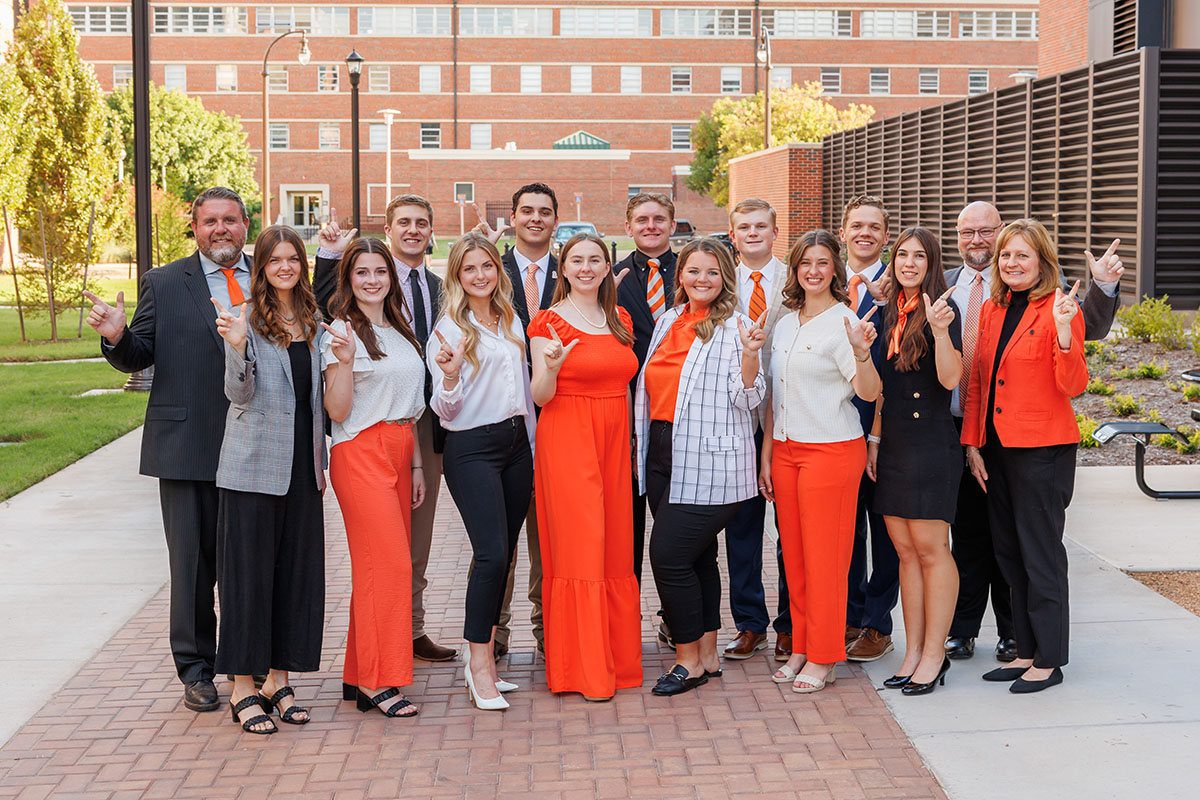 A group of students standing togther outside a building